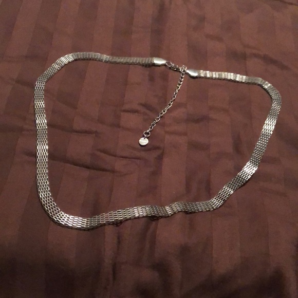 Jewelry - Jennifer Lopez. Silver tone necklace, possibly a belt.